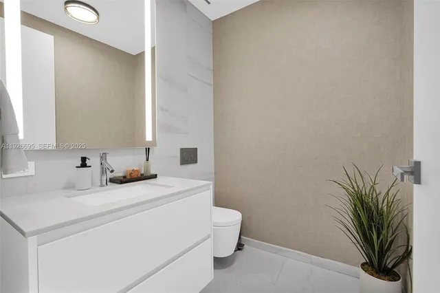 a spacious bedroom with a bed and a flat screen tv