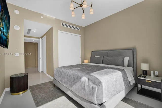 a dining room with lots of tables a large window and chairs