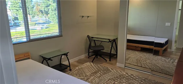 a room with closet and wooden floor