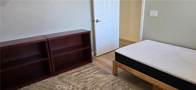 a room with a bed and a window