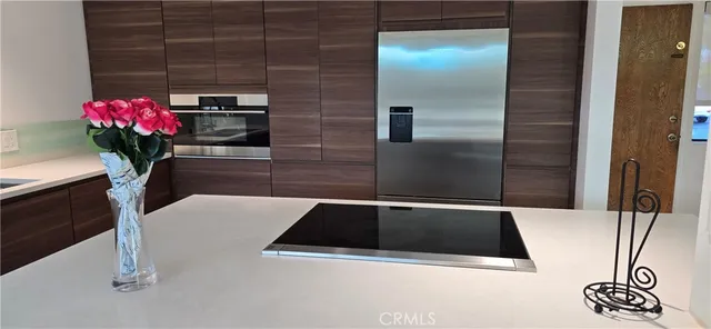 a close view of kitchen sink and stove