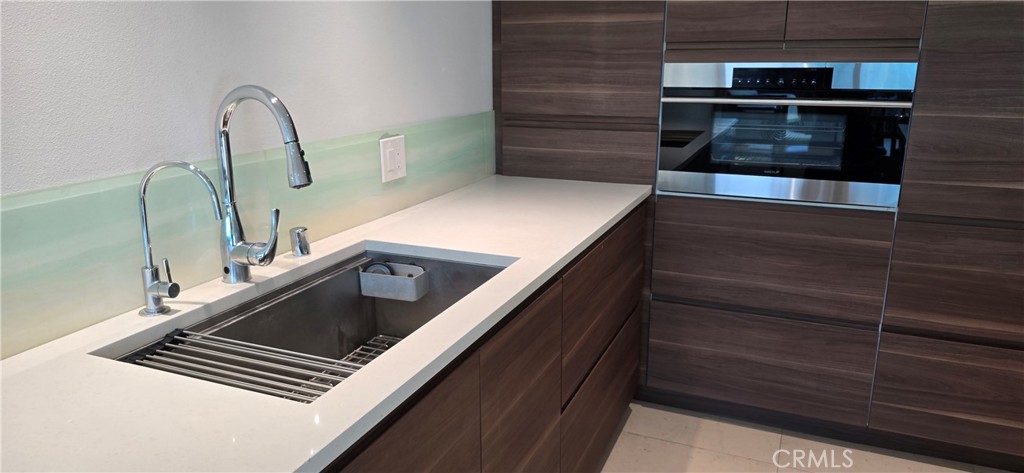 5224 Walnut Avenue, Unit 8 Irvine, CA 92618 - Photo 6 of 14 a close view of kitchen sink and stove