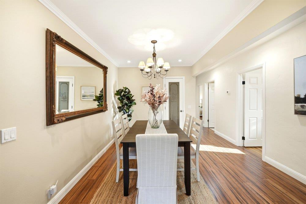 17235 Hill Road Morgan Hill, CA 95037 - Photo 12 of 44 a dining room with chandelier and wooden floor