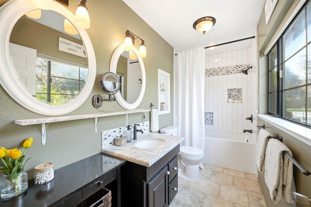 17235 Hill Road Morgan Hill, CA 95037 - Photo 19 of 44 a bathroom with a sink a mirror and a toilet