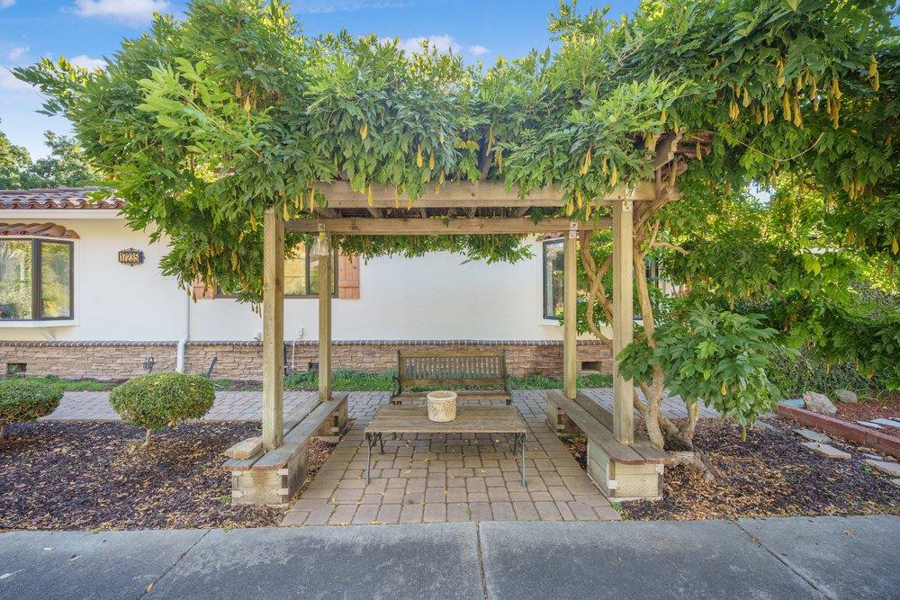 17235 Hill Road Morgan Hill, CA 95037 - Photo 36 of 44 a view of a patio with table and chairs and potted plants