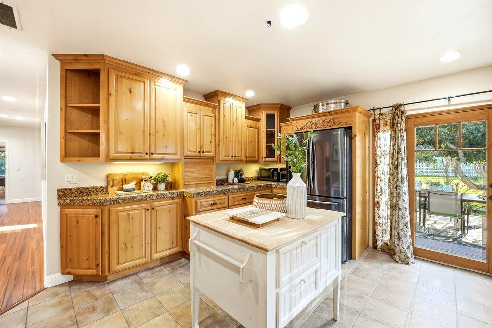 17235 Hill Road Morgan Hill, CA 95037 - Photo 6 of 44 a kitchen with a refrigerator a stove top oven and a sink