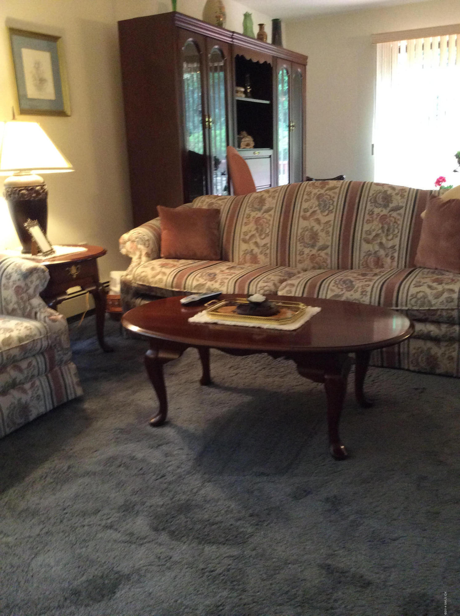 81 Pemberwick Road, Unit B Greenwich, CT 06831 - Photo 3 of 15 a living room with furniture and a table