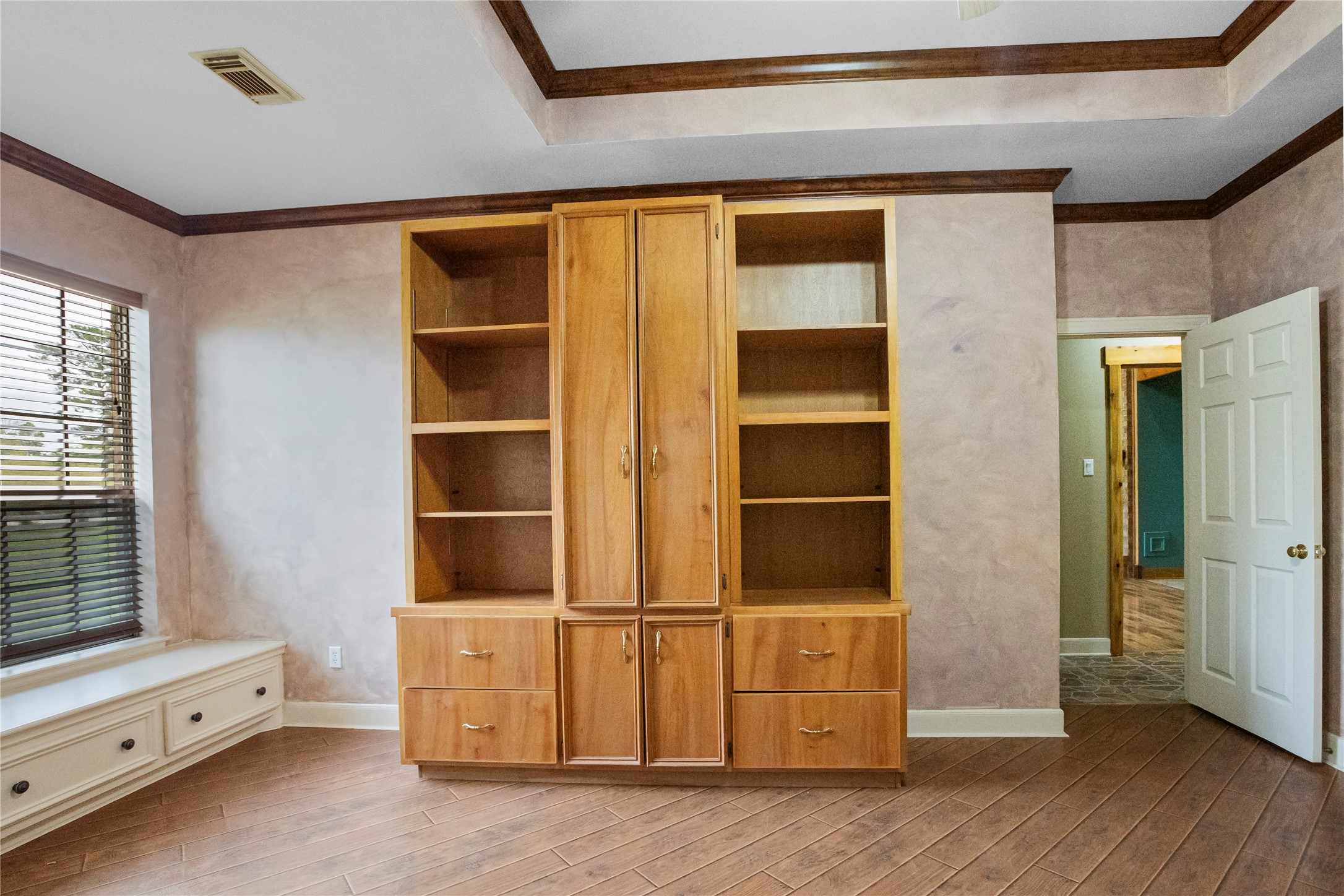 22916 East Martin Drive Porter, TX 77365 - Photo 26 of 43 a view of an empty room with wooden floor and windows