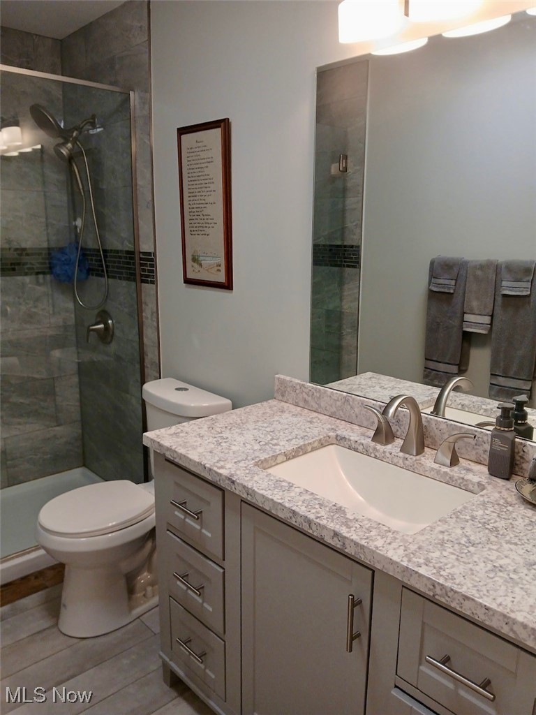 1685 Fattler Ridge Road Philo, OH 43771 - Photo 21 of 24 Bathroom featuring vanity and a shower stall
