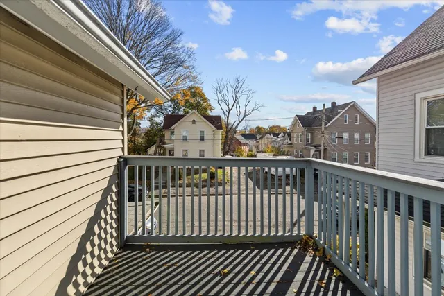 a view of a balcony with wooden fence