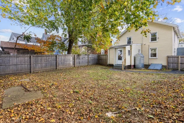 a house view with a backyard space