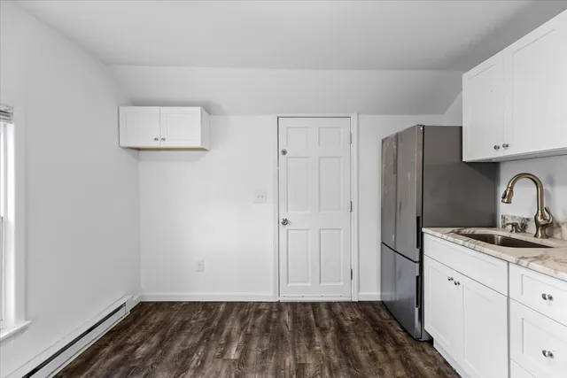 a view of kitchen with wooden floor