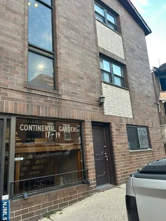 a front view of a house with a garage and window