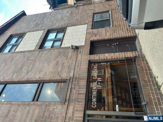 a front view of a house with a garage and window