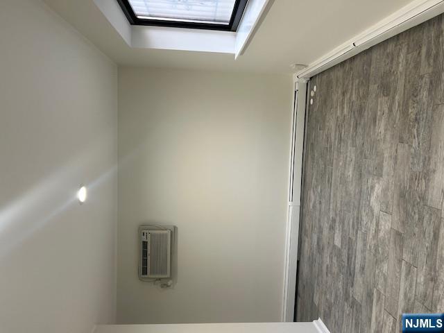 17-19 68th Street, Unit 1 Guttenberg, NJ 07093 - Photo 2 of 4 a view of a room with wooden floor and window