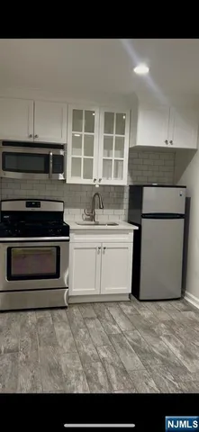 a kitchen with a stove and a microwave
