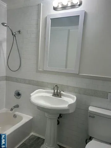 a bathroom with a sink and a toilet