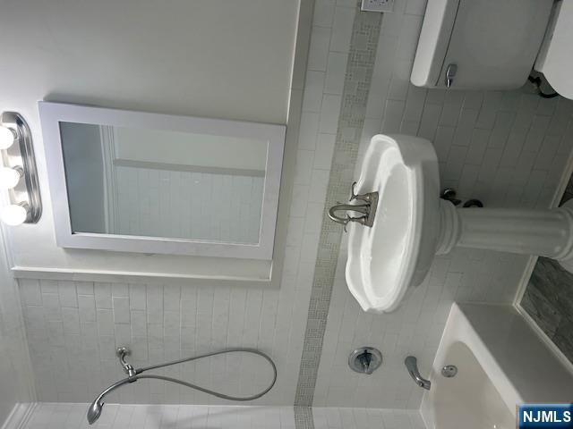 17-19 68th Street, Unit 1 Guttenberg, NJ 07093 - Photo 4 of 4 a bathroom with a sink and a toilet