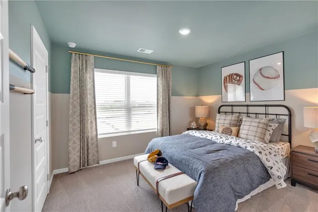 a bedroom with a bed and window