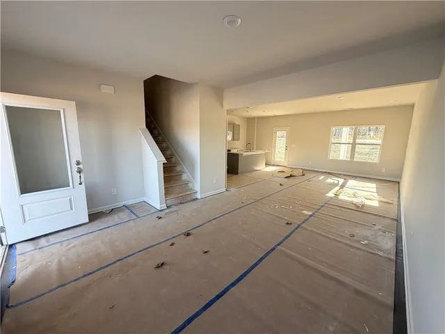 a view of an empty room and windows