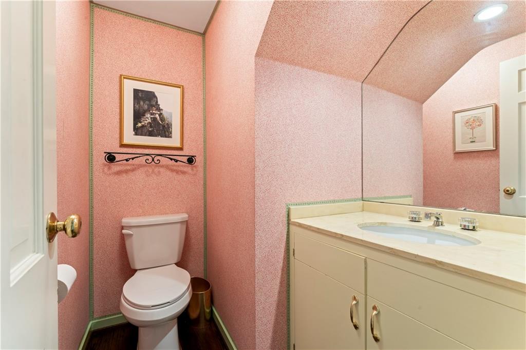 1521 Wightman Street Pittsburgh, PA 15217 - Photo 16 of 40 a bathroom with a granite countertop toilet sink and mirror