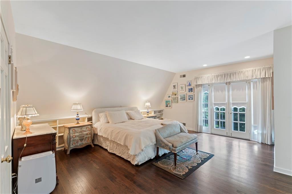 1521 Wightman Street Pittsburgh, PA 15217 - Photo 18 of 40 a bedroom with a bed and wooden floor