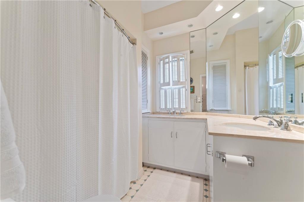 1521 Wightman Street Pittsburgh, PA 15217 - Photo 22 of 40 a bathroom with a sink and a mirror