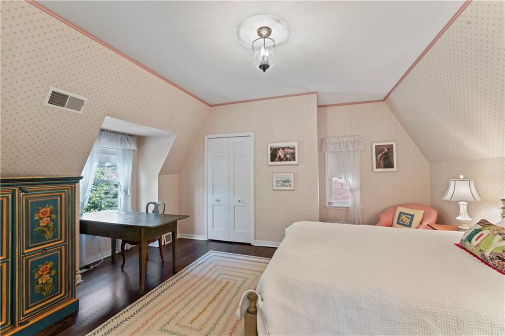 1521 Wightman Street Pittsburgh, PA 15217 - Photo 26 of 40 a bedroom with a bed and wooden floor
