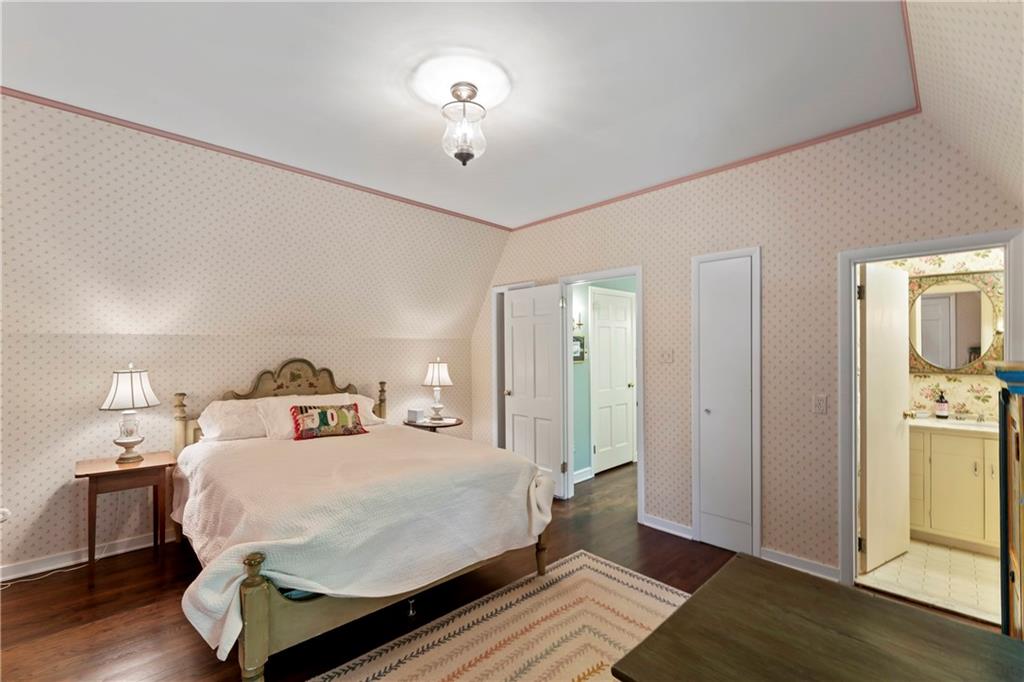 1521 Wightman Street Pittsburgh, PA 15217 - Photo 27 of 40 a large bedroom with a bed and wooden floor