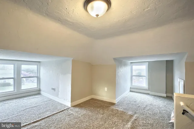 an empty room with a natural light