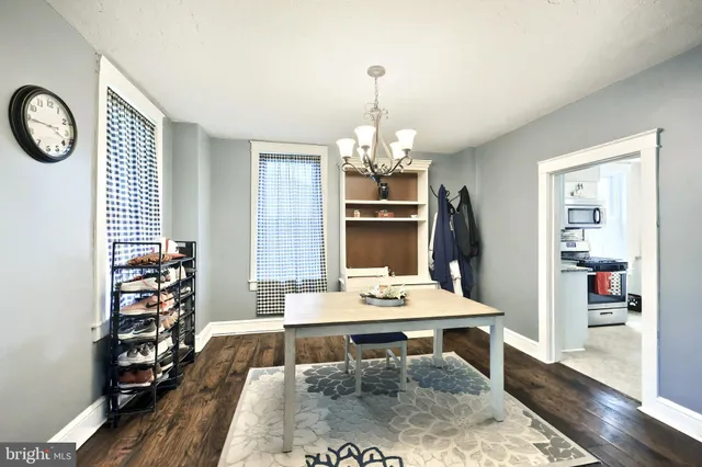 a kitchen with stainless steel appliances granite countertop a stove top oven a sink dishwasher a refrigerator and a microwave