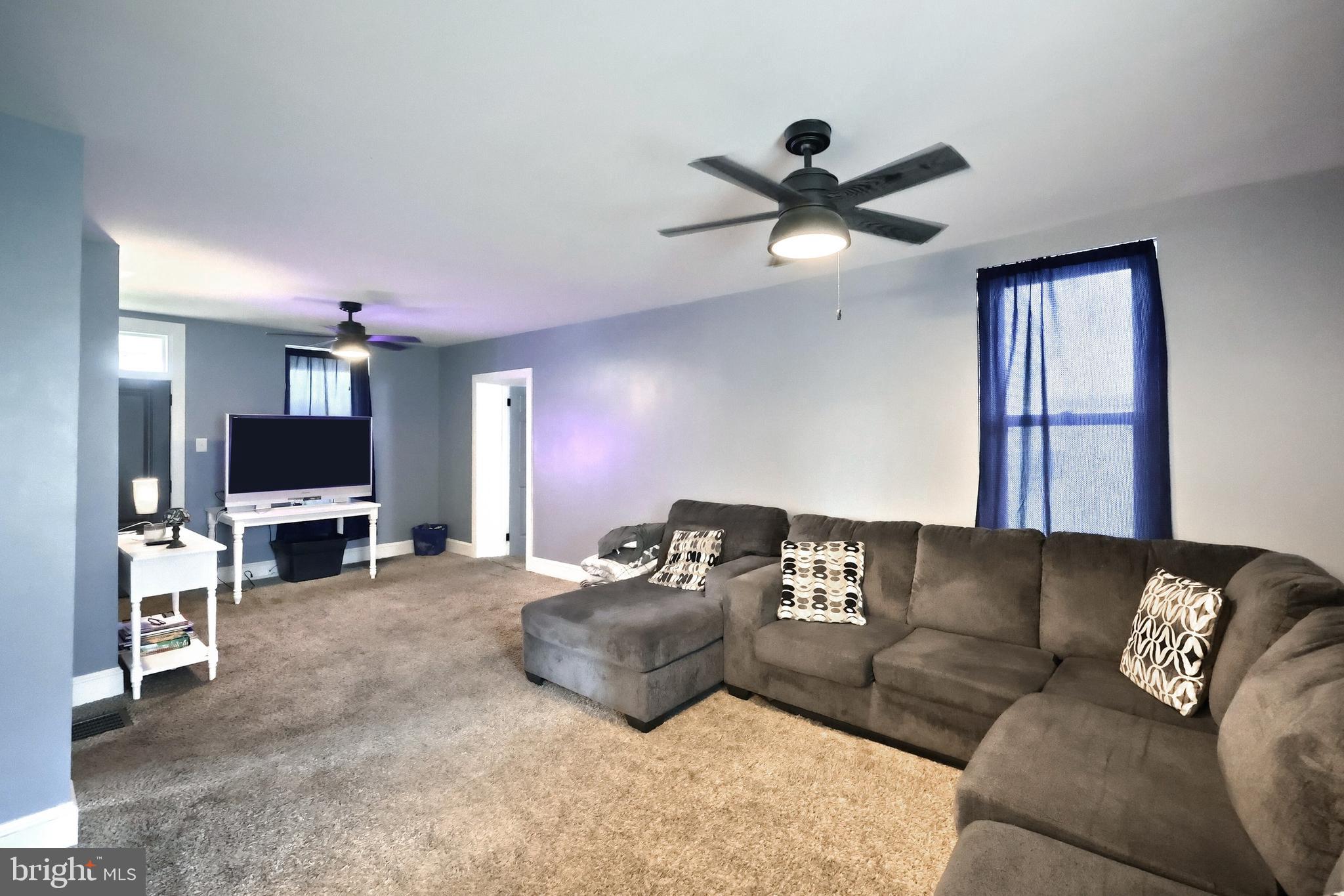 14 Gateway Road York, PA 17403 - Photo 6 of 35 a living room with furniture a ceiling fan and a window