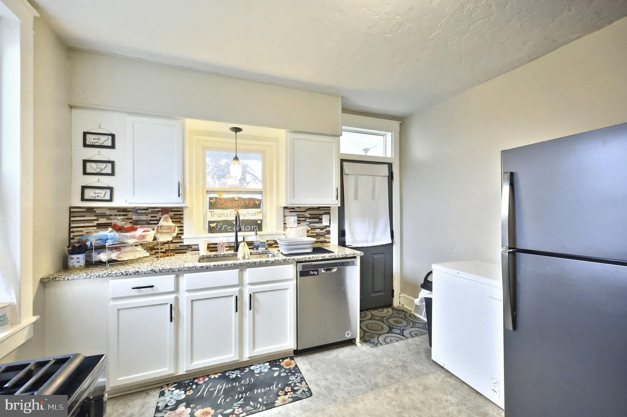 14 Gateway Road York, PA 17403 - Photo 10 of 35 a kitchen with a sink a refrigerator and cabinets