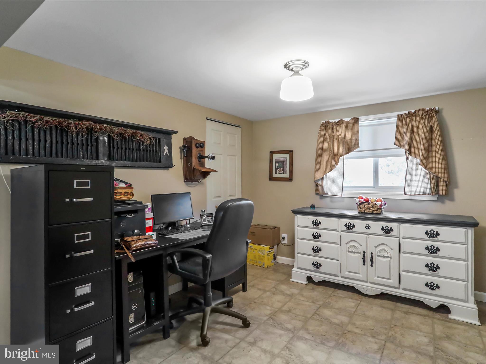 97 Devonshire Road Hedgesville, WV 25427 - Photo 12 of 44 a bedroom with a baby bed a desk and chair with wooden floor