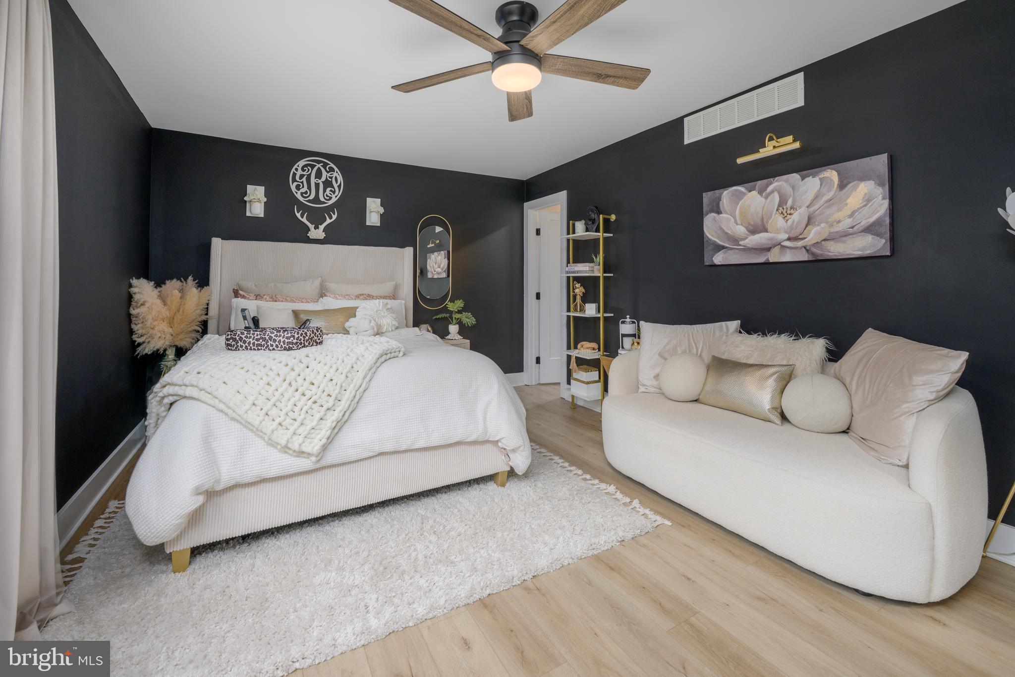 3 Drake Terrace Sewell, NJ 08080 - Photo 23 of 34 a bedroom with a large bed and a chandelier