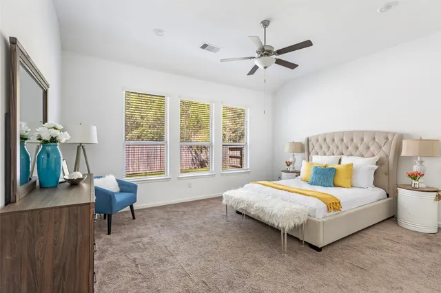 a bedroom with a bed and a dresser