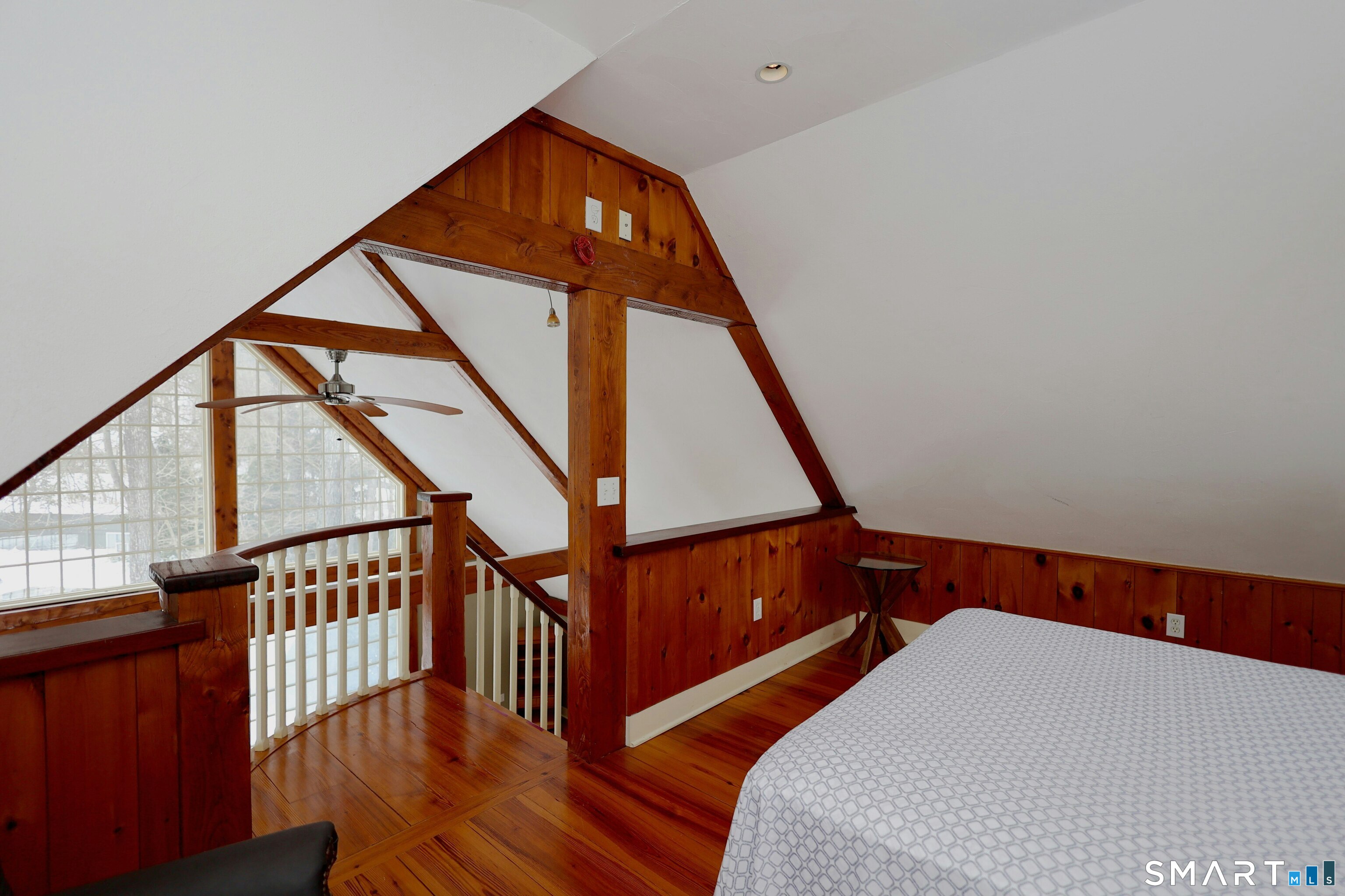 369 Florida Hill Road Ridgefield, CT 06877 - Photo 19 of 35 a bedroom with wooden floor and stairs