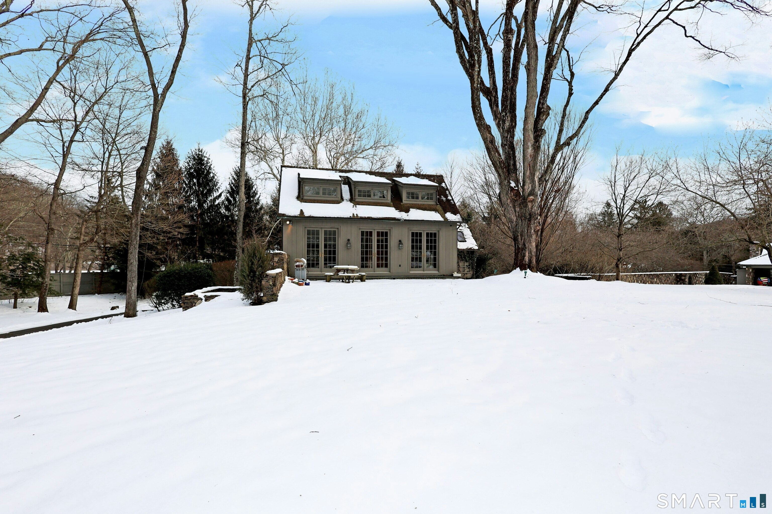 369 Florida Hill Road Ridgefield, CT 06877 - Photo 24 of 35 a front view of a house with a yard covered in snow