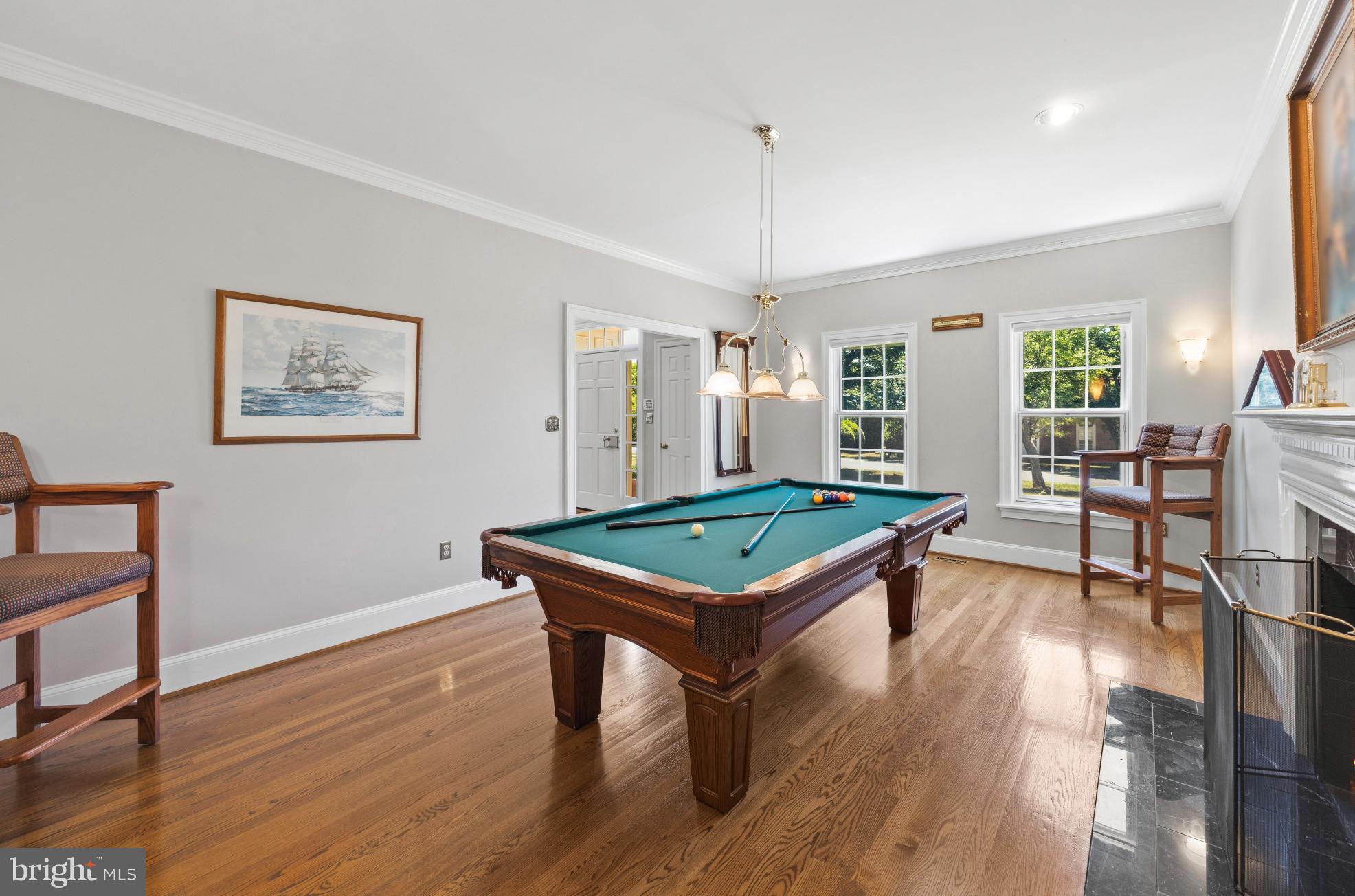 3403 Hidden River View Road Annapolis, MD 21403 - Photo 7 of 50 a room with furniture pool table wooden floor and windows