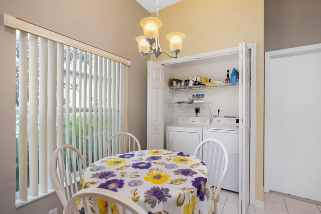 a bedroom that has a bed and a table in it