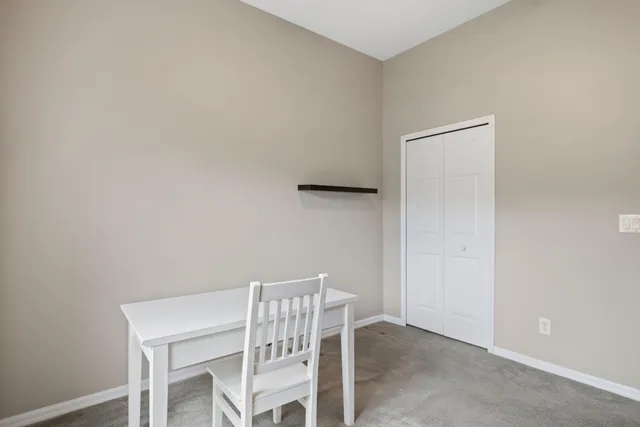 a view of a room with table and chair