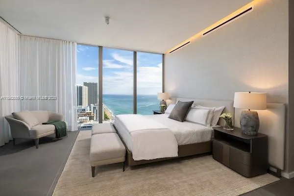 a bedroom with a bed and a couch