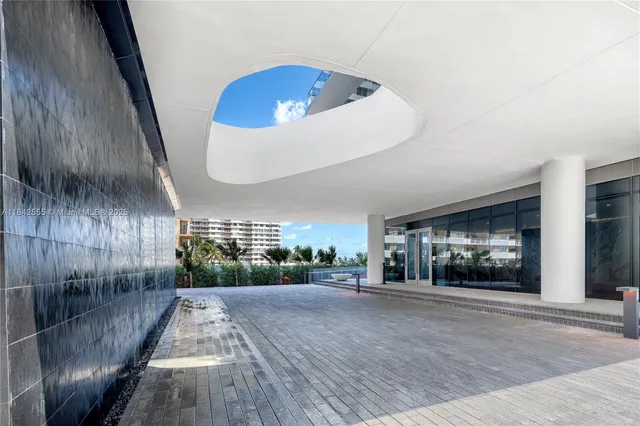 an empty room with a fireplace and painted walls