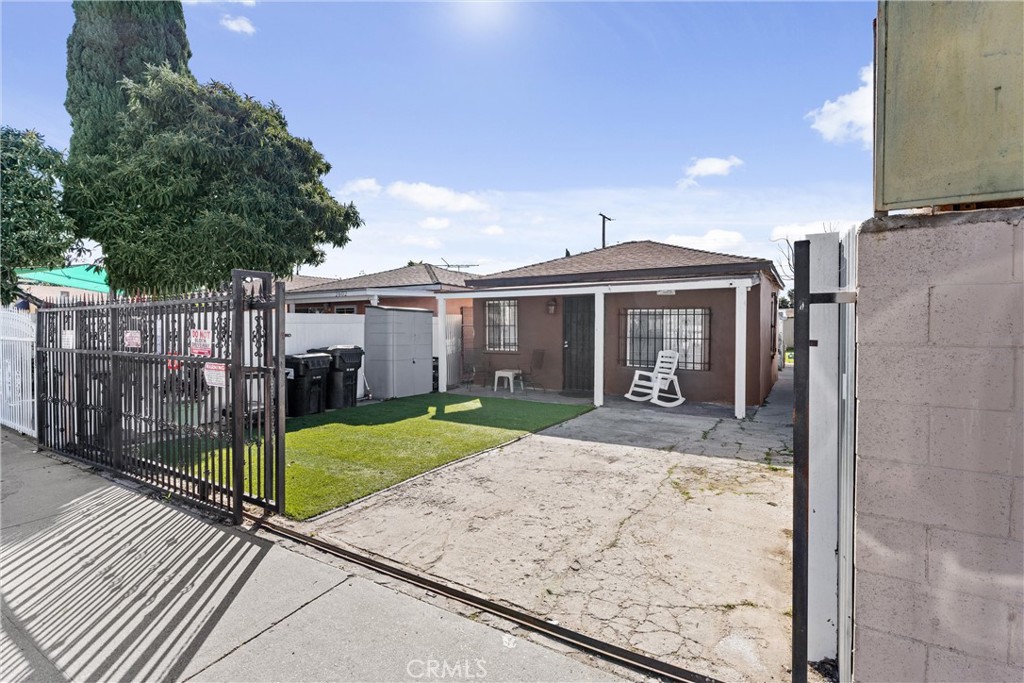 2600 East 126th Street Compton, CA 90222 - Photo 1 of 1 a front view of a house with garden