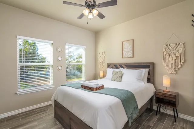 a bedroom with a bed and a window