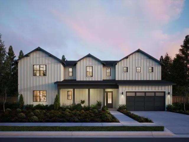 a house with lots of trees in the background