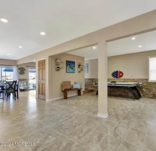a view of a livingroom with furniture and a flat screen tv
