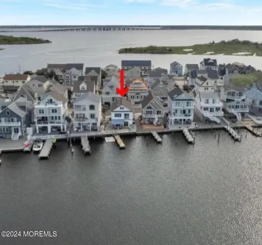a view of a room with water heater and racks