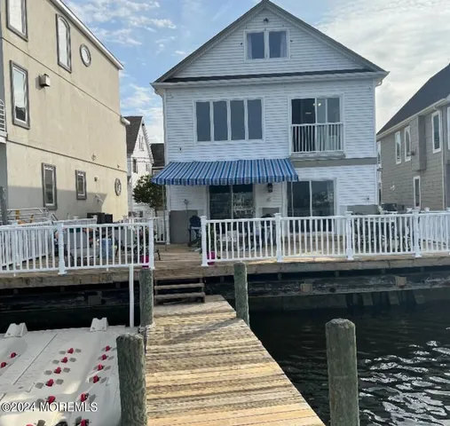 a view of a wooden deck with a yard