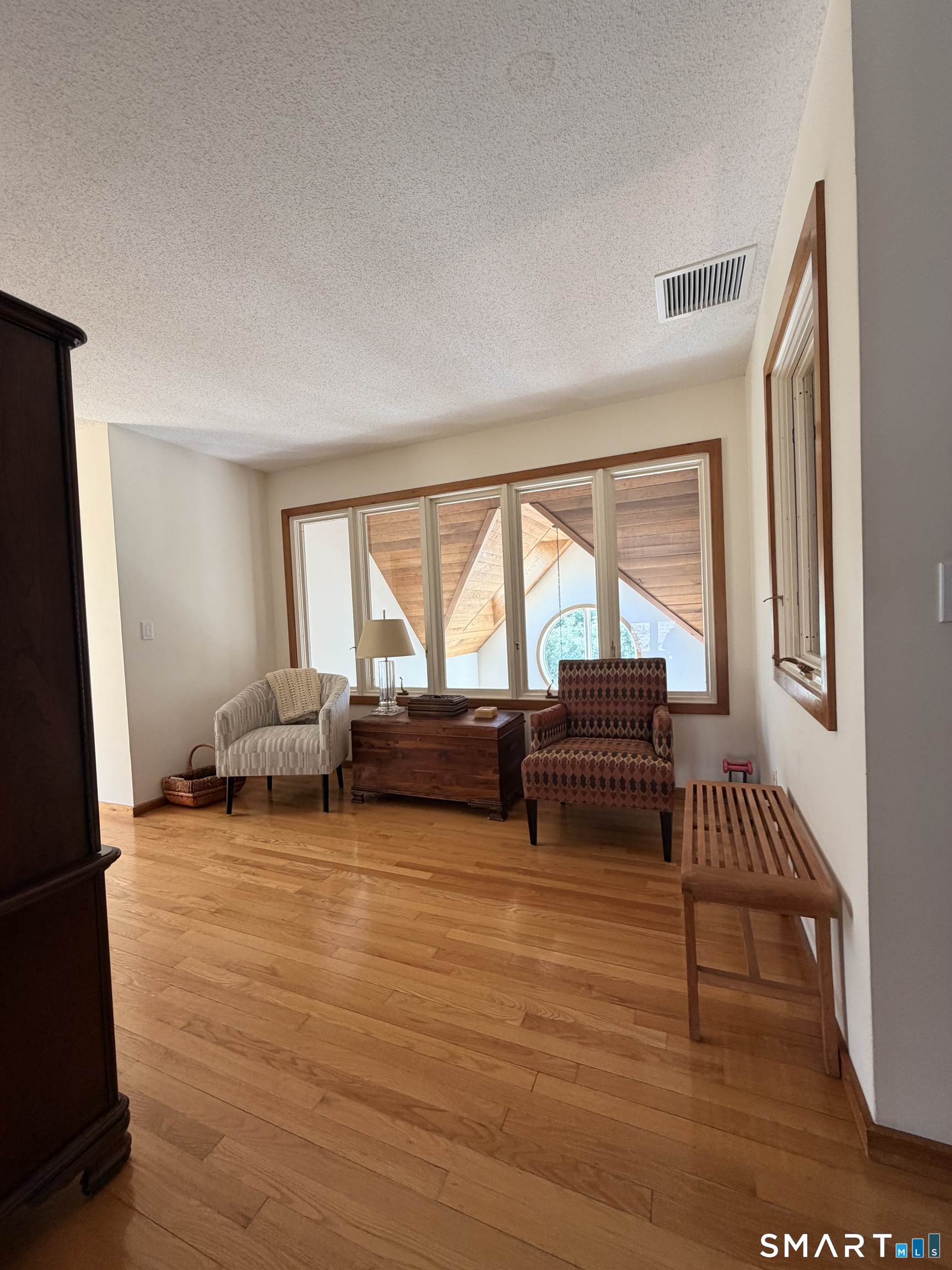 86 Washburn Road Canton, CT 06019 - Photo 26 of 40 a living room with furniture and a large window